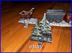 3D cast iron Santa train set with 6 Christmas stocking holders with trees HTF